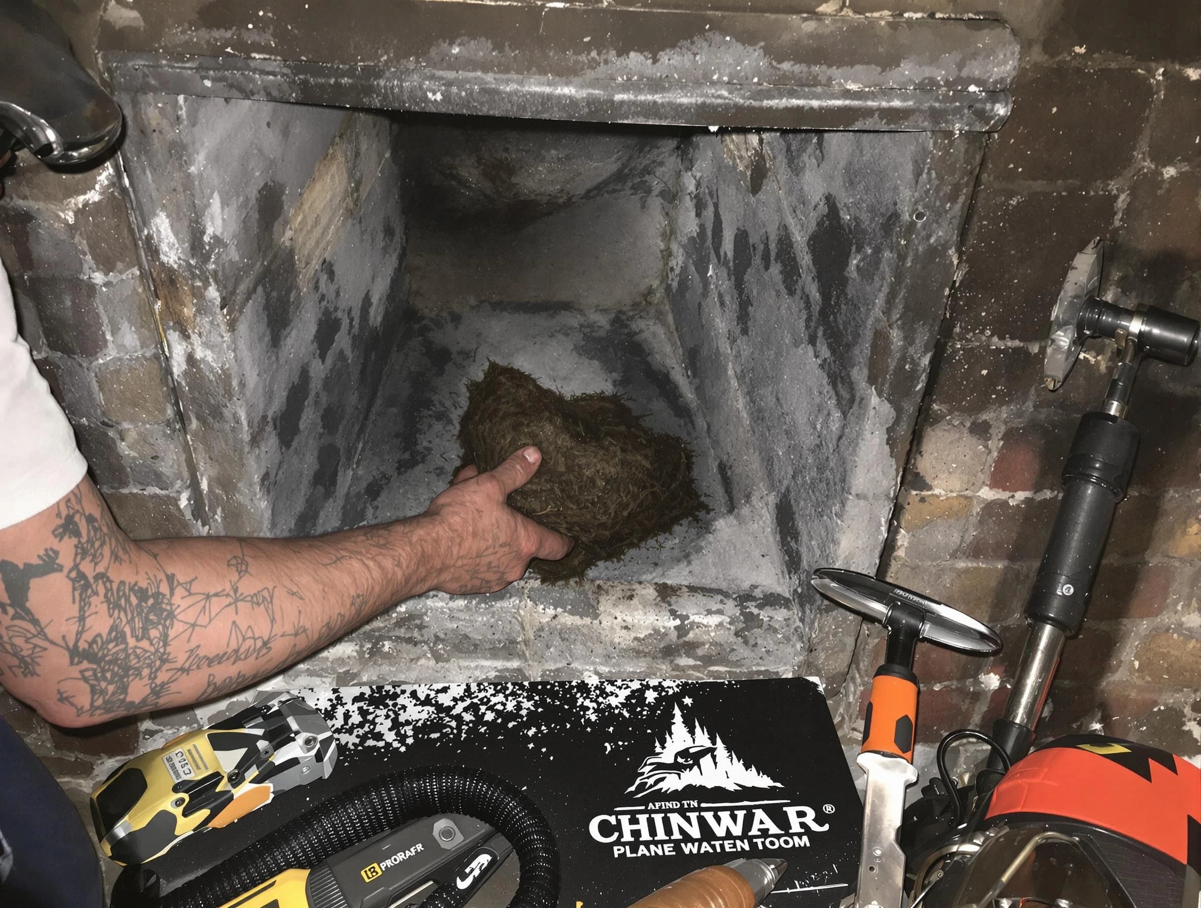 Millburn Chimney Sweep safely removing debris and screening chimney in Millburn, NJ